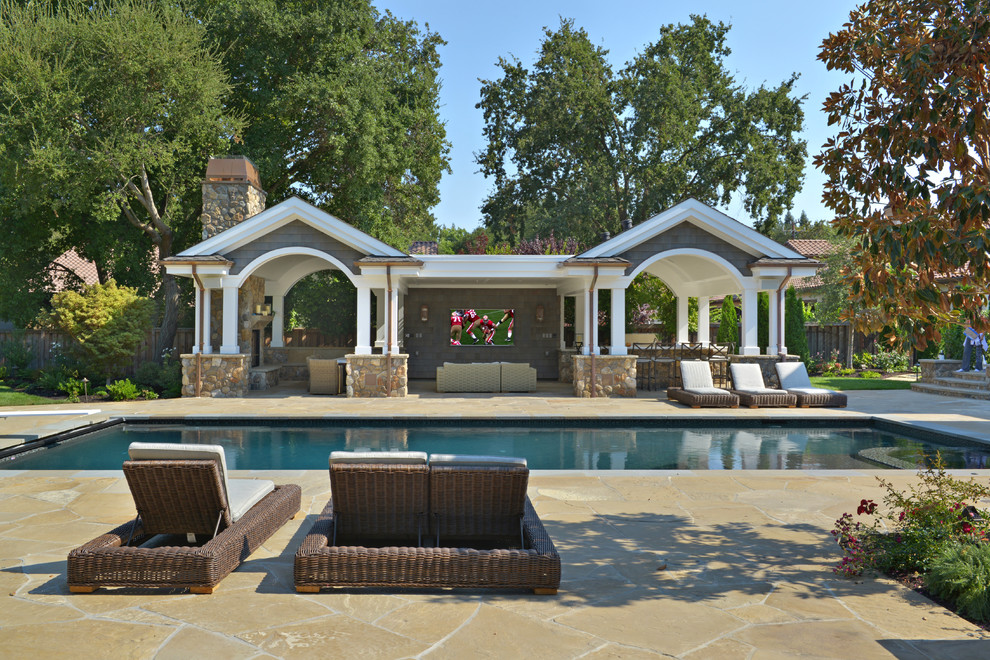 Inspiration for a mid-sized arts and crafts backyard rectangular lap pool in San Francisco with natural stone pavers.