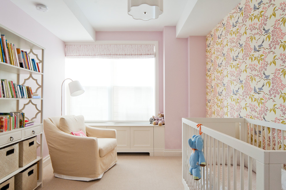 Design ideas for a mid-sized transitional nursery for girls in New York with pink walls, carpet and beige floor.