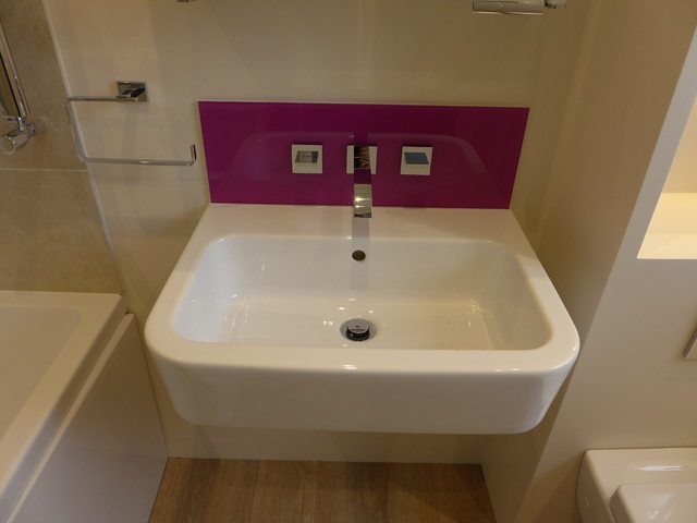 Wall Hung Handbasin With Purple Glass Splashback