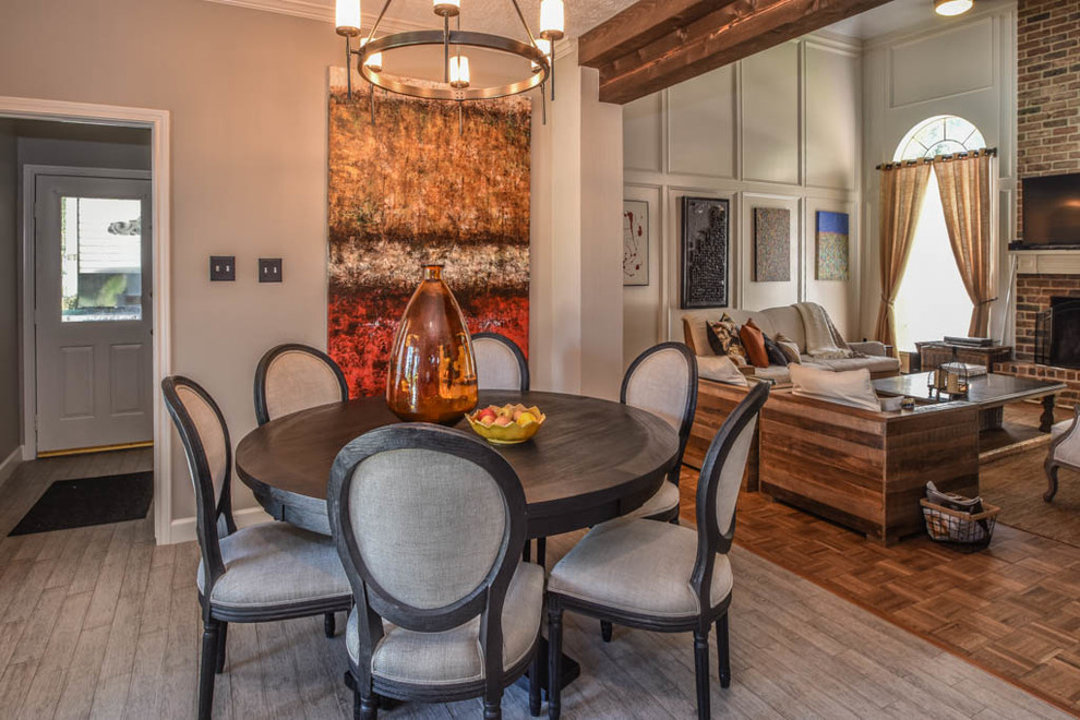 Inspiration for a mid-sized transitional light wood floor great room remodel in Houston with gray walls