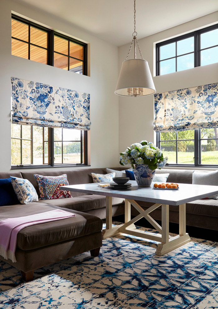 Inspiration for a transitional dining room in Denver with white walls and carpet.