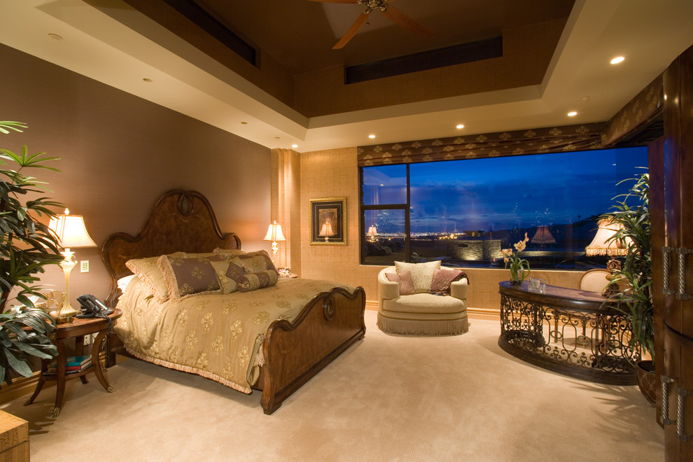 Design ideas for an expansive arts and crafts master bedroom in Las Vegas with beige walls, carpet, beige floor and wallpaper.