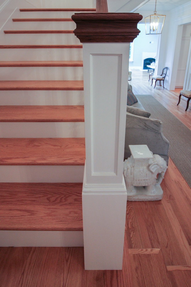Design ideas for a mid-sized arts and crafts wood u-shaped staircase in DC Metro with wood risers and wood railing.