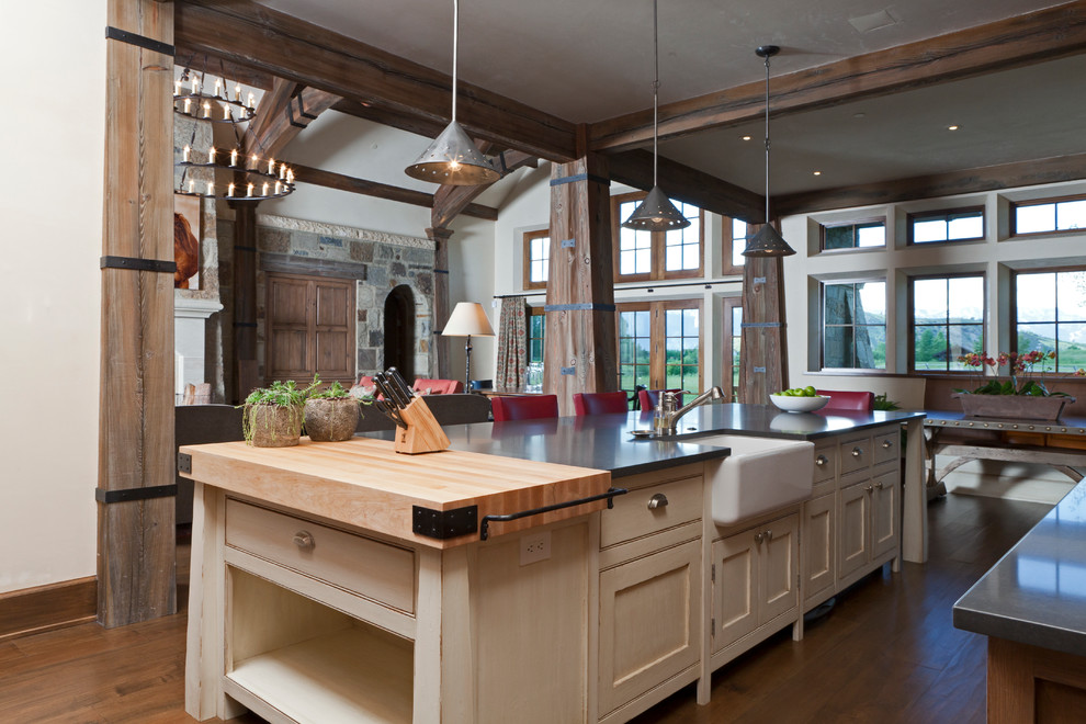Inspiration for a large transitional l-shaped open plan kitchen in Other with a farmhouse sink, beaded inset cabinets, white cabinets, zinc benchtops, stainless steel appliances, medium hardwood floors and with island.