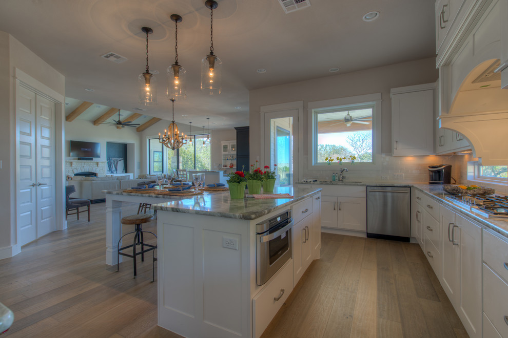 Eat-in kitchen - transitional eat-in kitchen idea in Austin with an island
