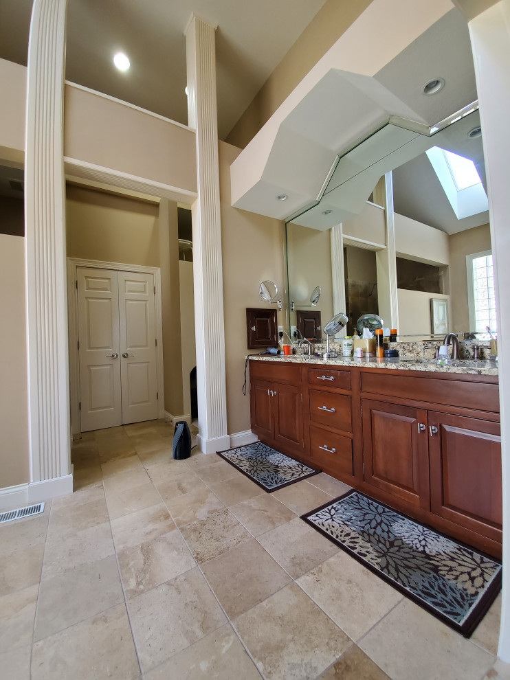 Photo of a large modern master bathroom in Indianapolis with raised-panel cabinets, white cabinets, a freestanding tub, an open shower, a one-piece toilet, white tile, cement tile, grey walls, cement tiles, an undermount sink, engineered quartz benchtops, white floor, a hinged shower door, white benchtops, a niche, a double vanity and a built-in vanity.