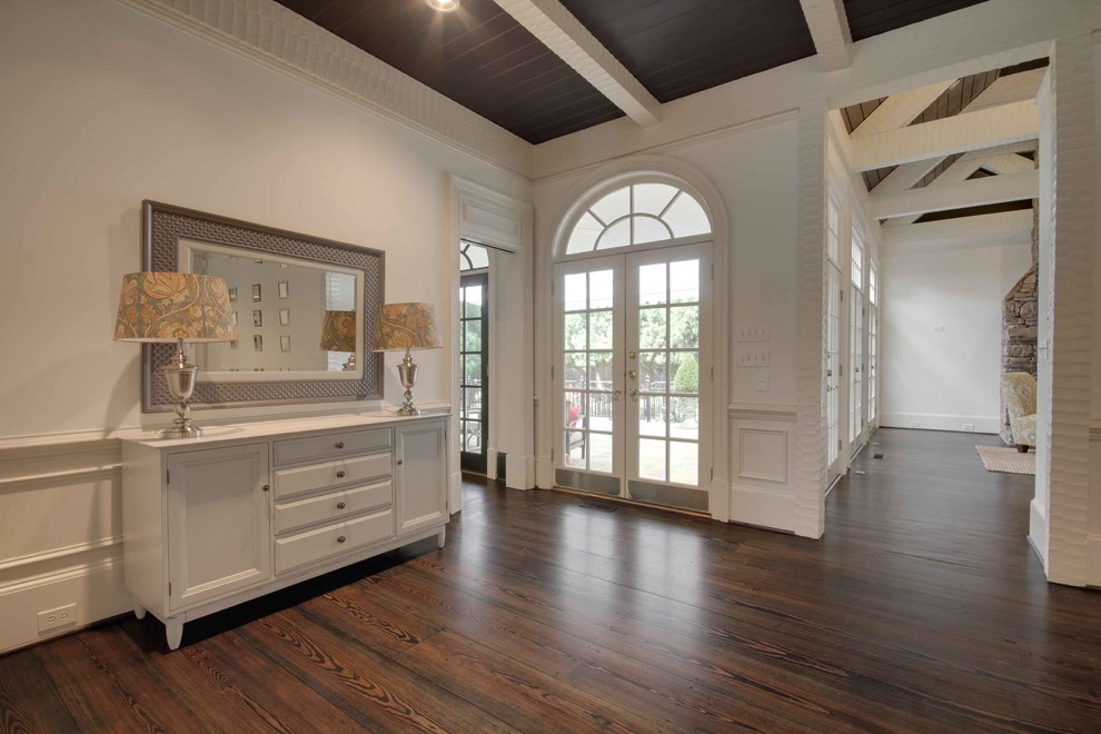 Inspiration for a large transitional hallway in Atlanta with white walls and dark hardwood floors.