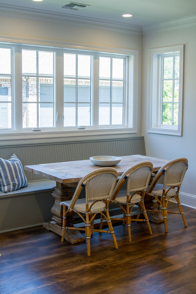 Transitional medium tone wood floor and brown floor eat-in kitchen photo with beaded inset cabinets, gray cabinets, white backsplash, paneled appliances, an island and white countertops