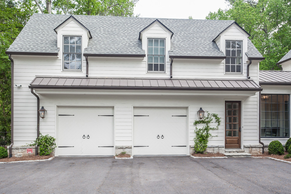 Photo of a large traditional attached two-car garage in Atlanta.