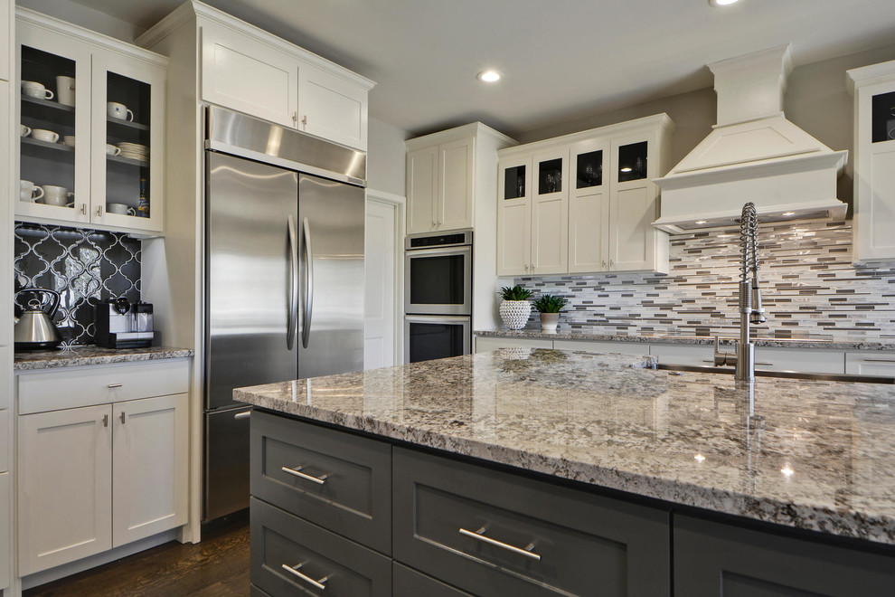 Enclosed kitchen - large transitional l-shaped dark wood floor enclosed kitchen idea in Austin with an undermount sink, shaker cabinets, white cabinets, granite countertops, gray backsplash, mosaic tile backsplash, stainless steel appliances and an island