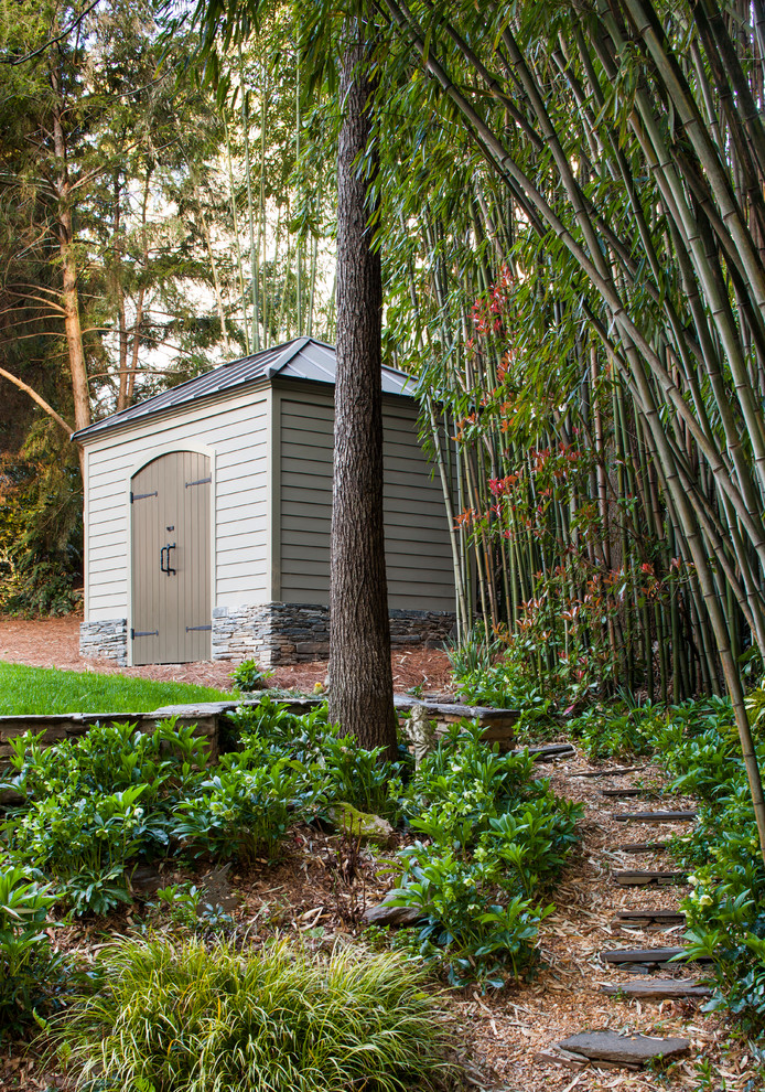This is an example of a mid-sized traditional detached garden shed in Atlanta.