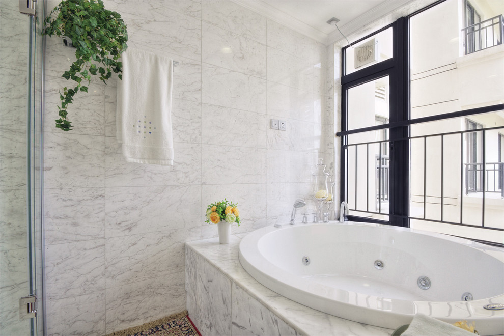Master bathroom in DC Metro with a drop-in tub, a corner shower, marble, white walls, marble floors, marble benchtops, grey floor, a hinged shower door and grey benchtops.