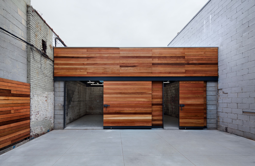 This is an example of a large contemporary three-car garage in New York.