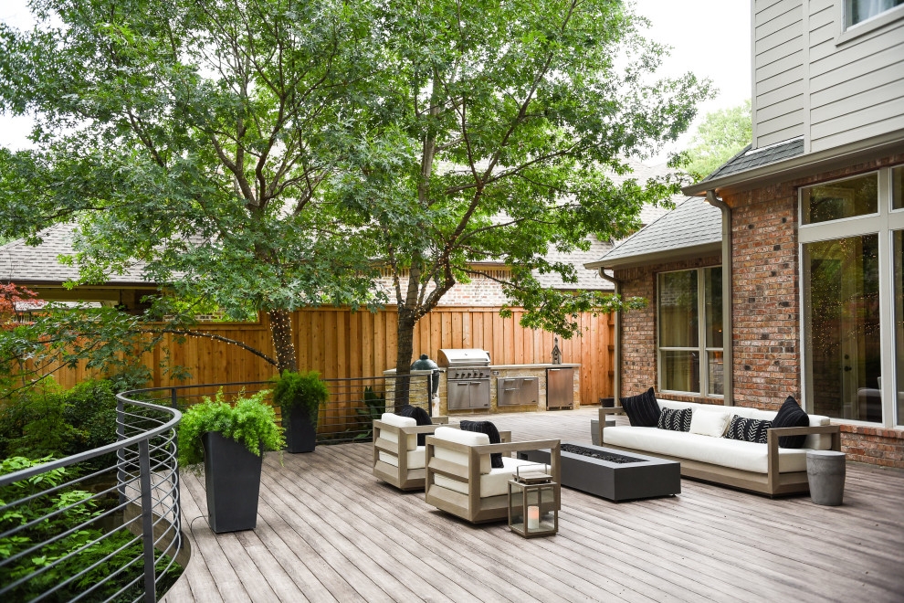 Transitional backyard deck in Dallas with no cover.