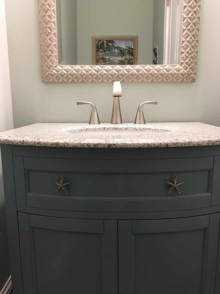 Inspiration for a mid-sized beach style powder room in Orange County with shaker cabinets, blue cabinets, beige walls, dark hardwood floors, an undermount sink and granite benchtops.