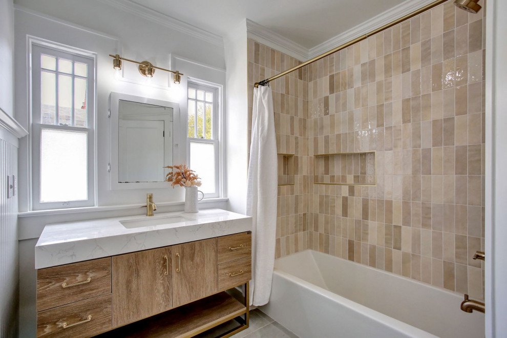 Inspiration for a small arts and crafts 3/4 bathroom in Portland with flat-panel cabinets, light wood cabinets, an alcove tub, a shower/bathtub combo, a two-piece toilet, beige tile, porcelain tile, white walls, porcelain floors, an undermount sink, solid surface benchtops, grey floor, a shower curtain, white benchtops, a niche, a single vanity and a freestanding vanity.