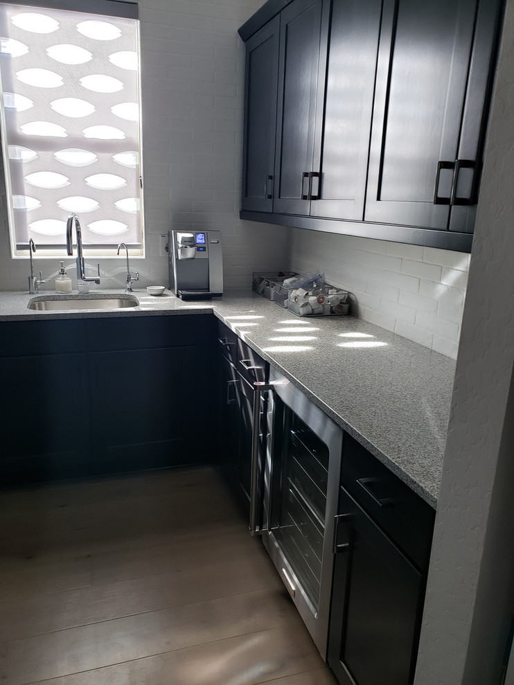 Kitchen pantry - mid-sized transitional kitchen pantry idea in Phoenix with an undermount sink, shaker cabinets, dark wood cabinets, quartz countertops, stainless steel appliances, no island and white countertops