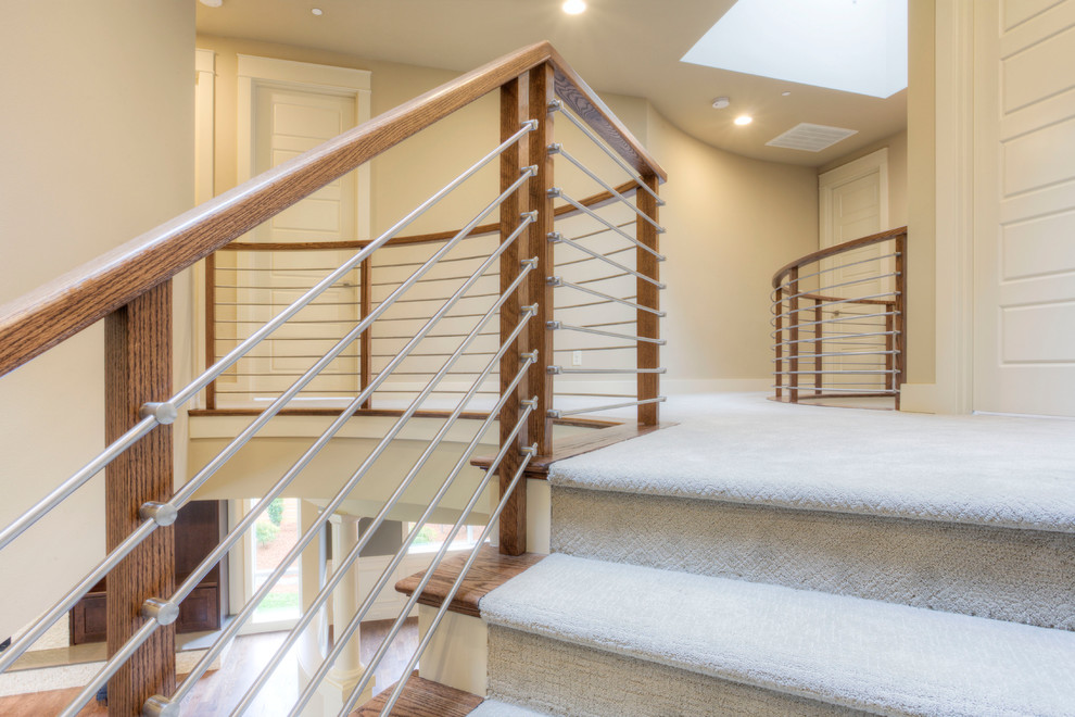 Inspiration for a mid-sized modern carpeted curved staircase in Seattle with carpet risers.