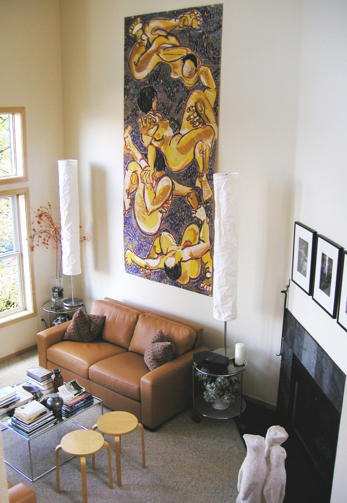 This is an example of an eclectic living room in Portland with a standard fireplace.