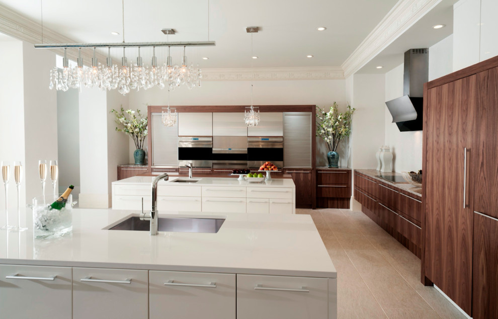 Design ideas for a large contemporary galley separate kitchen in Miami with an undermount sink, flat-panel cabinets, medium wood cabinets, quartz benchtops, white splashback, stone slab splashback, panelled appliances, cement tiles, multiple islands and beige floor.