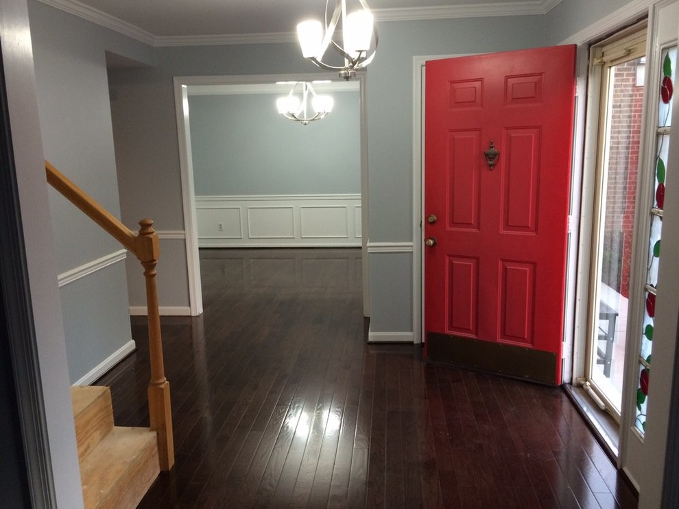 Example of a mid-sized transitional dark wood floor hallway design in DC Metro with gray walls
