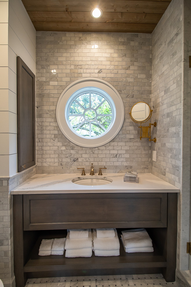 Large traditional ensuite bathroom in Cleveland with freestanding cabinets, dark wood cabinets, a walk-in shower, multi-coloured tiles, a hinged door, a single sink, a built in vanity unit and a wood ceiling.