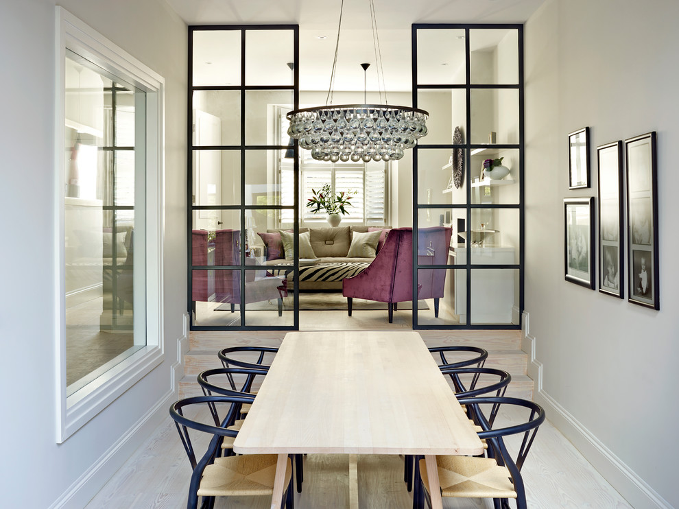 Contemporary dining room in Other with white walls, light hardwood floors and beige floor.
