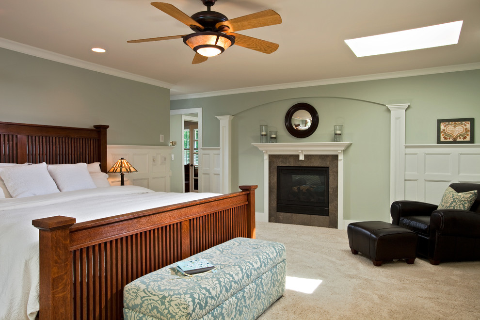 Mid-sized traditional master bedroom in Boston with green walls, carpet, a standard fireplace and a tile fireplace surround.