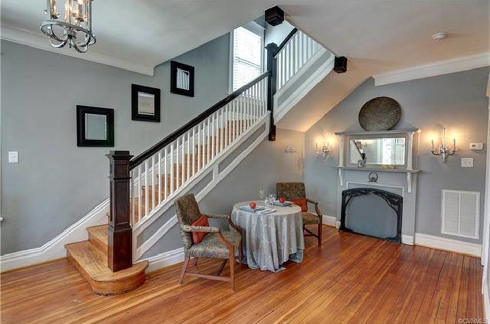 Inspiration for a large arts and crafts wood l-shaped staircase in Richmond with wood risers and wood railing.