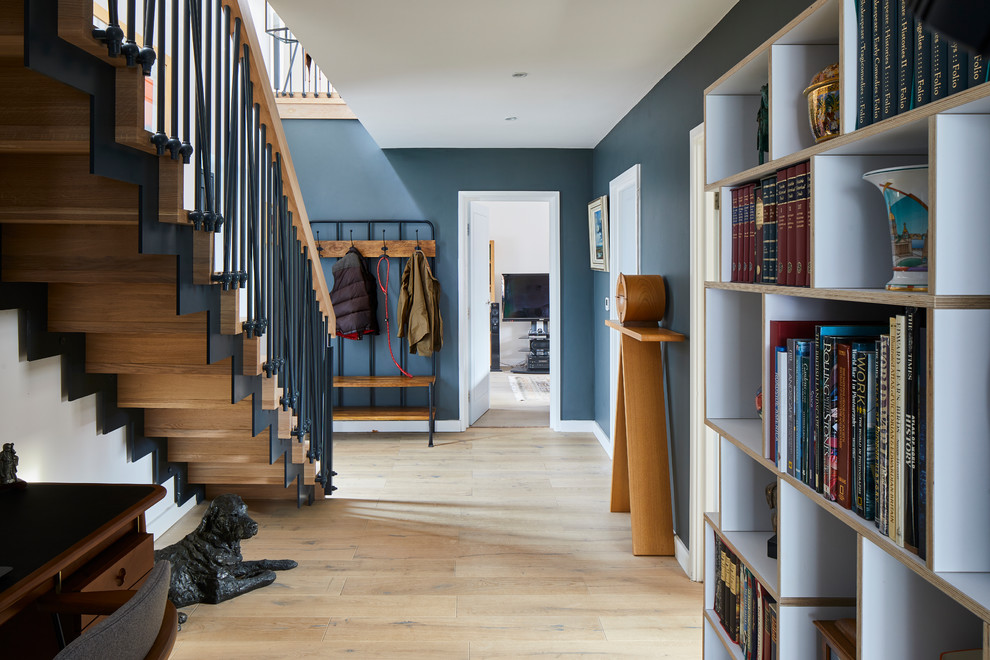 Design ideas for a scandinavian hallway in Other with blue walls, medium hardwood floors and brown floor.