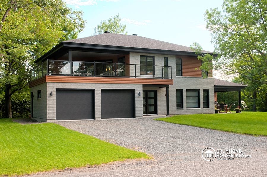 Inspiration for a mid-sized contemporary gray two-story brick exterior home remodel in Cleveland