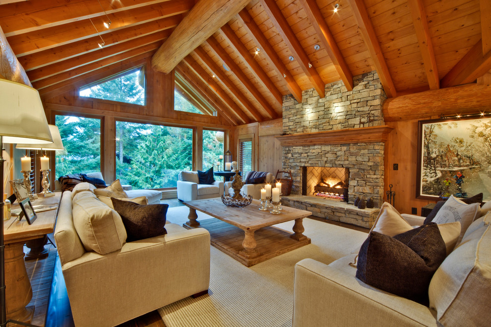 Design ideas for a traditional living room in Vancouver with a stone fireplace surround.