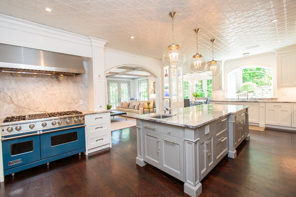 Traditional l-shaped open plan kitchen in Boston with recessed-panel cabinets, grey cabinets, coloured appliances, dark hardwood floors and with island.