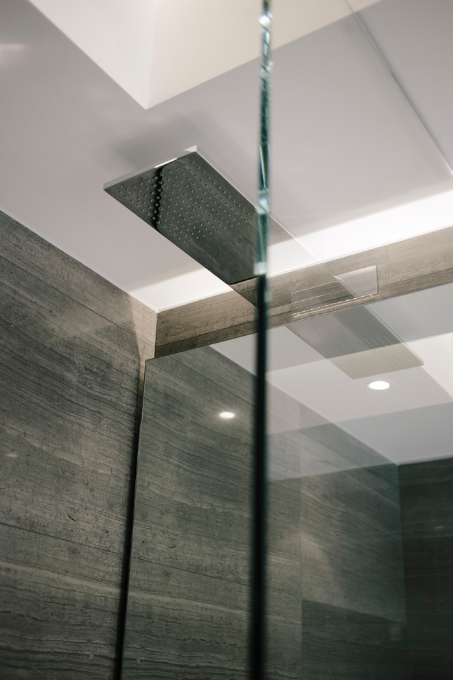 This is an example of a mid-sized contemporary 3/4 bathroom in Vancouver with a corner shower, brown tile, brown walls, a wall-mount sink and an open shower.