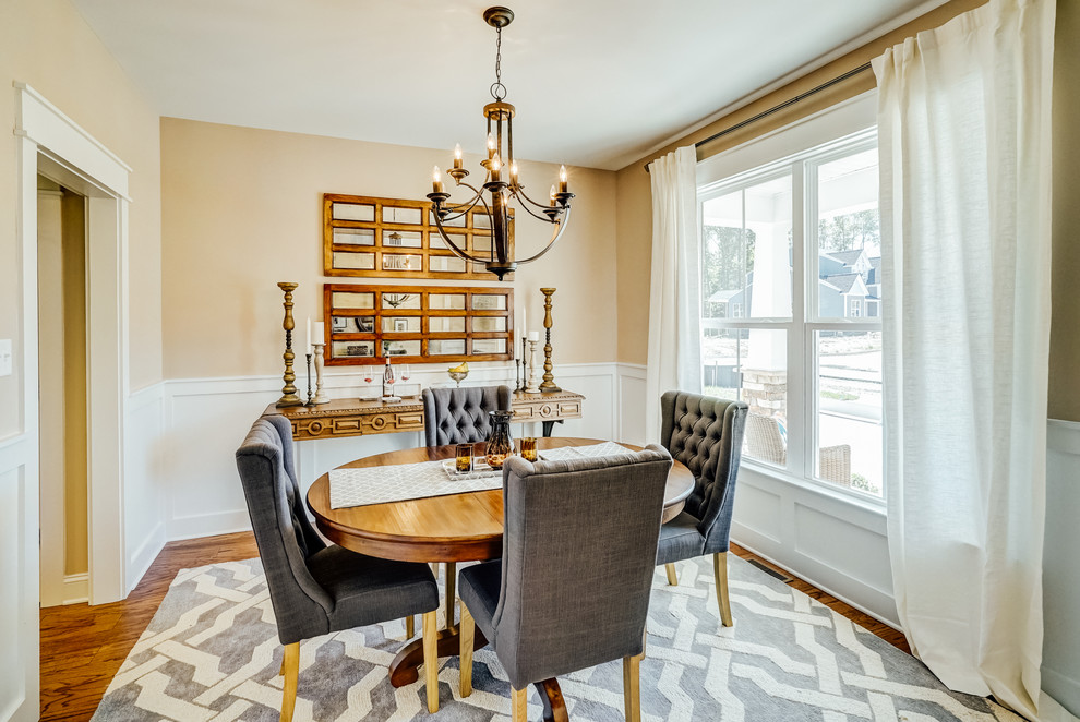 Dining room - mid-sized transitional medium tone wood floor dining room idea in Richmond with beige walls