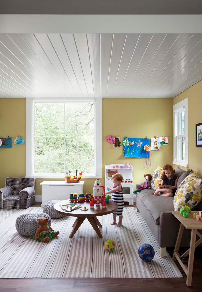 Inspiration for a farmhouse playroom remodel in Austin with yellow walls