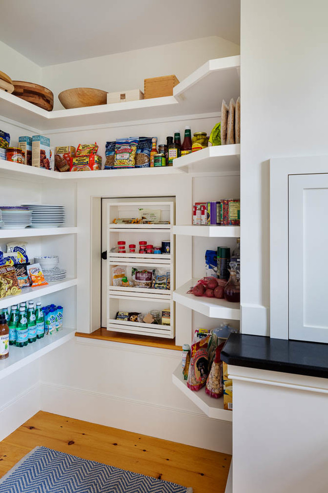 Kitchen pantry - traditional medium tone wood floor kitchen pantry idea in Boston with open cabinets, white cabinets and granite countertops