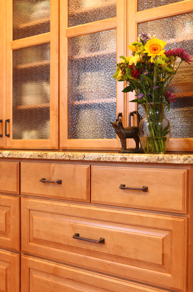 Inspiration for a mid-sized transitional medium tone wood floor dining room remodel in New York