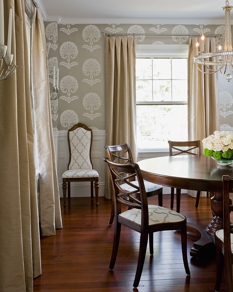 Traditional dining room in Boston with multi-coloured walls and medium hardwood floors.
