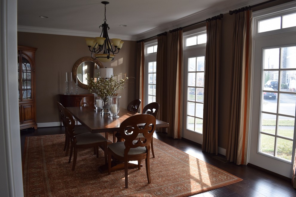 This is an example of a large transitional separate dining room in DC Metro with dark hardwood floors.