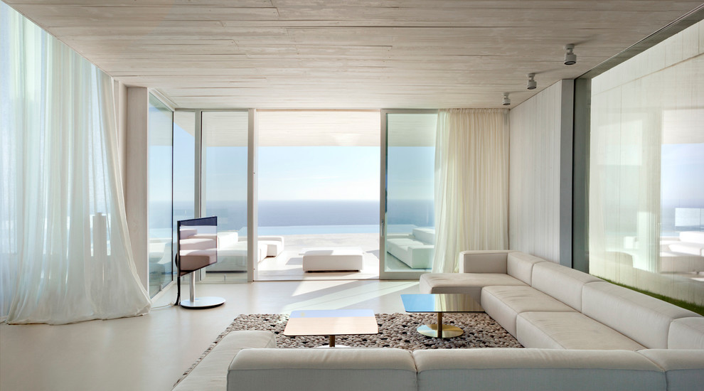 Inspiration for a huge modern formal and enclosed light wood floor living room remodel in Alicante-Costa Blanca with white walls, a tv stand and no fireplace