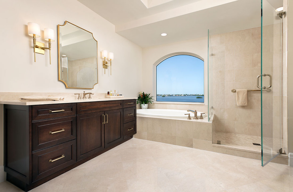 Bathroom - large contemporary master beige tile and marble tile marble floor, beige floor, single-sink and tray ceiling bathroom idea in Miami with recessed-panel cabinets, brown cabinets, a two-piece toilet, beige walls, an undermount sink, marble countertops, a hinged shower door, beige countertops and a built-in vanity