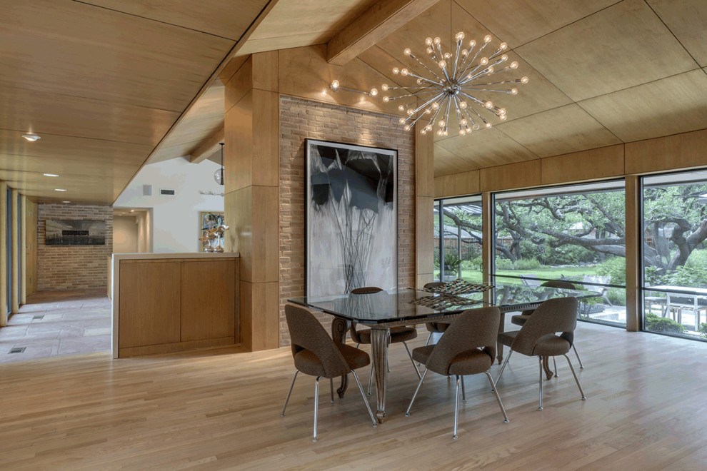 Mid-sized midcentury open plan dining in Dallas with light hardwood floors, beige floor, beige walls and no fireplace.