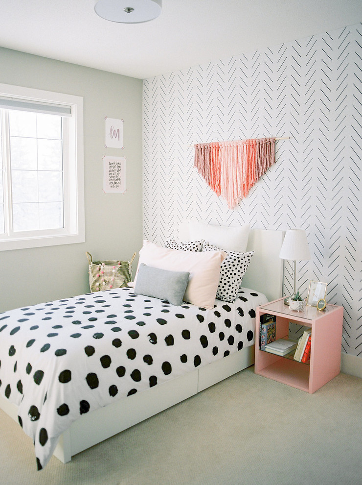 This is an example of a mid-sized modern kids' room for girls in Calgary with white walls, carpet and beige floor.