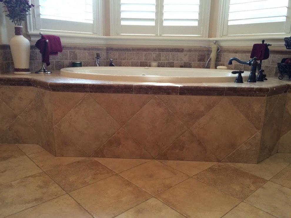 Large master beige tile and ceramic tile ceramic tile drop-in bathtub photo in Sacramento with beige walls