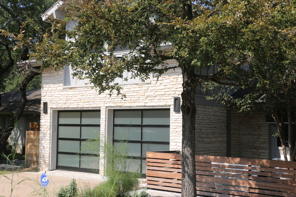 Mid-sized contemporary attached garage in Austin.