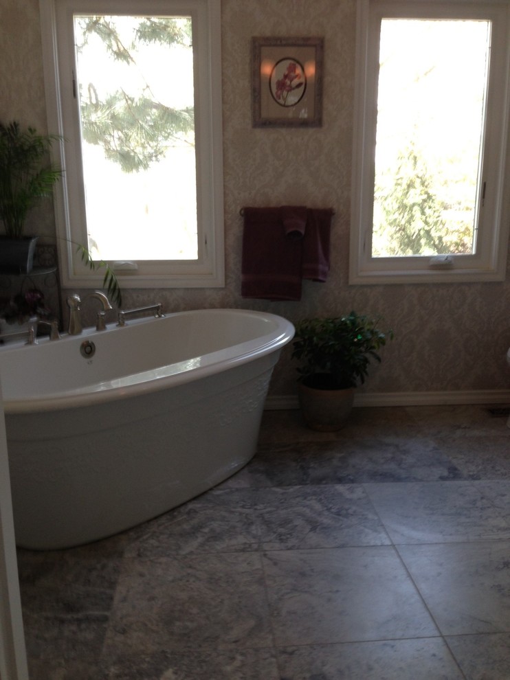Example of a small transitional gray tile travertine floor bathroom design in Seattle