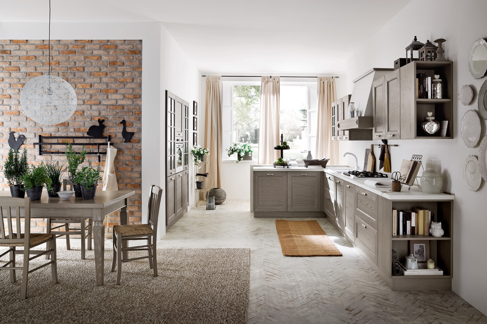 Design ideas for a contemporary eat-in kitchen in Miami with grey cabinets and brick floors.