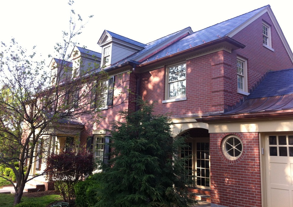 Photo of a mid-sized traditional two-storey brick exterior in Louisville.