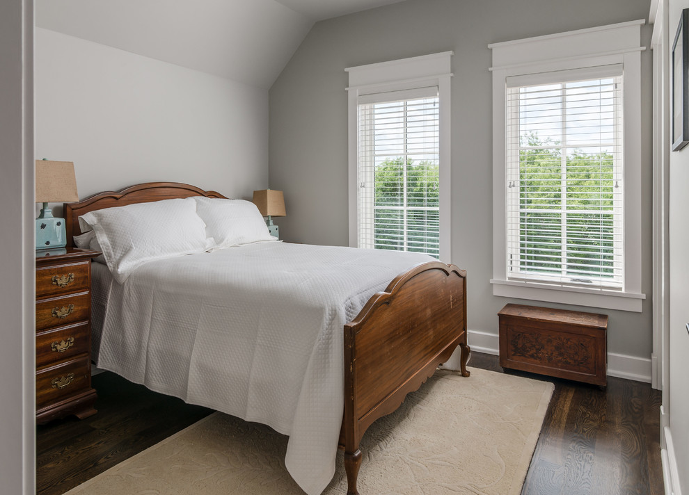 Transitional guest bedroom in Nashville with grey walls, dark hardwood floors and brown floor.